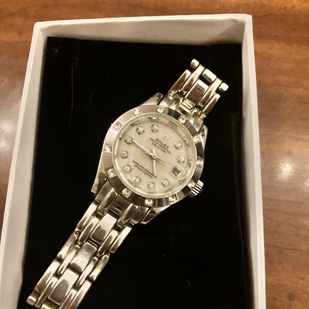 Rolex Silver Watch with Diamond Accents